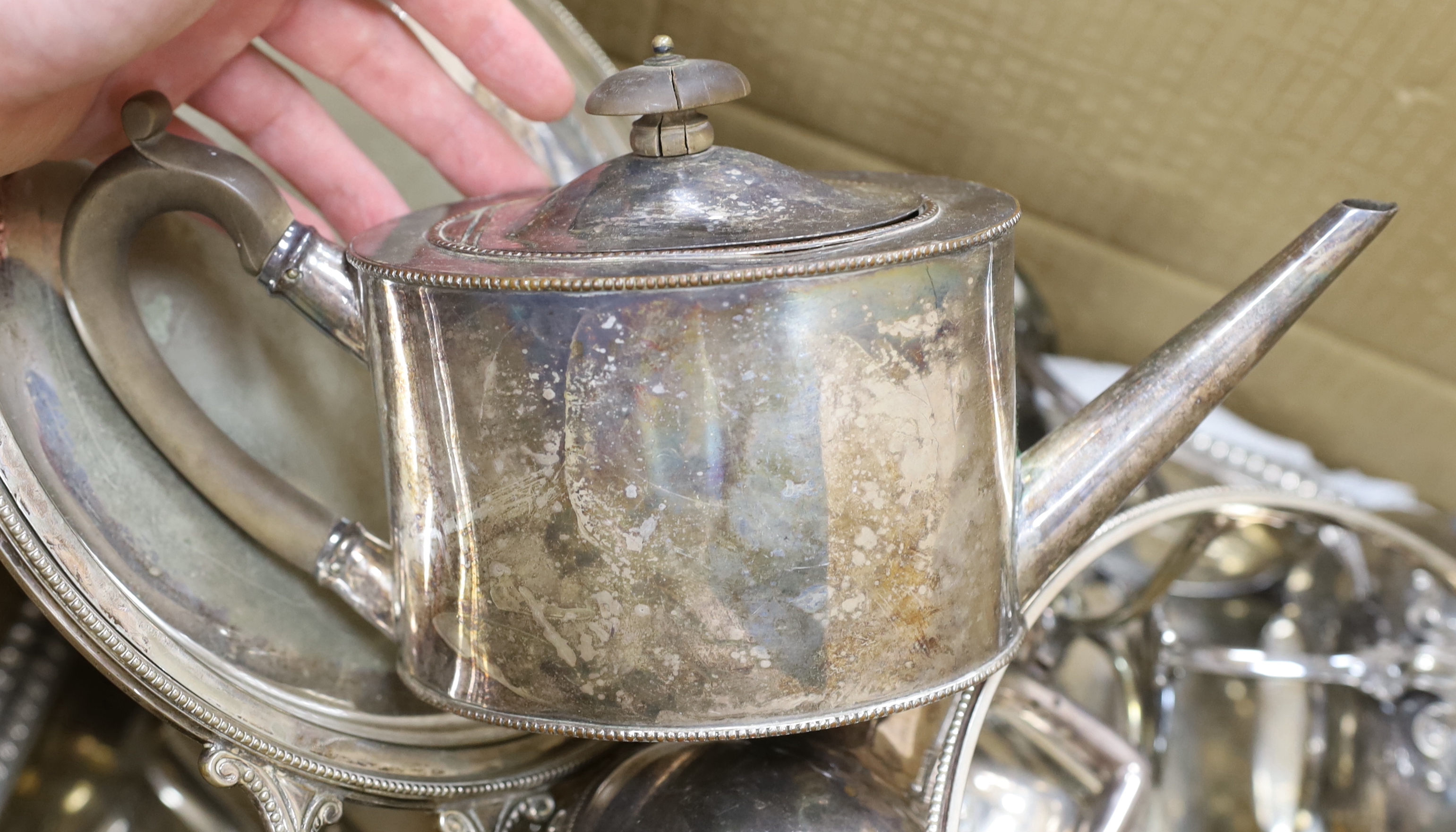 A collection of plated wares, including entree dishes, an oval engraved tray, a circular vegetable tureen and cover, two teapots, etc.
